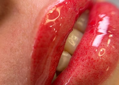 Close-up of glossy red lips at Mansi Beauty Nz, Auckland, Auckland, NZ.