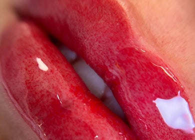 Glossy red lips close-up at Mansi Beauty Nz, Auckland, Auckland, NZ, showcasing expert lip care.