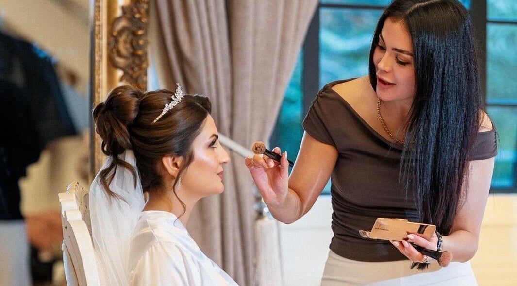 Makeup artist enhancing a bride's look at Mansi Beauty Nz, Auckland, Auckland, NZ.