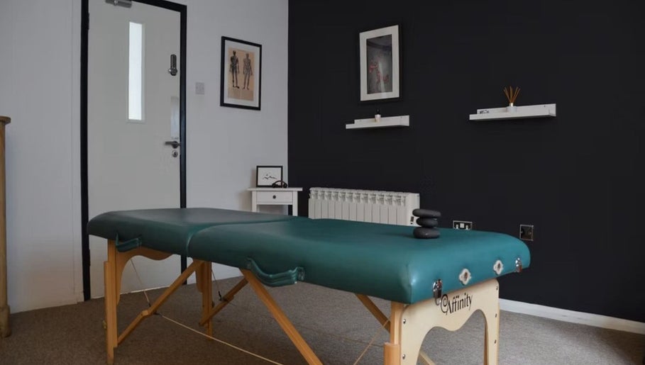 Massage table in serene room at The Unburden, Hassocks, England, GB, offering relaxing therapies.