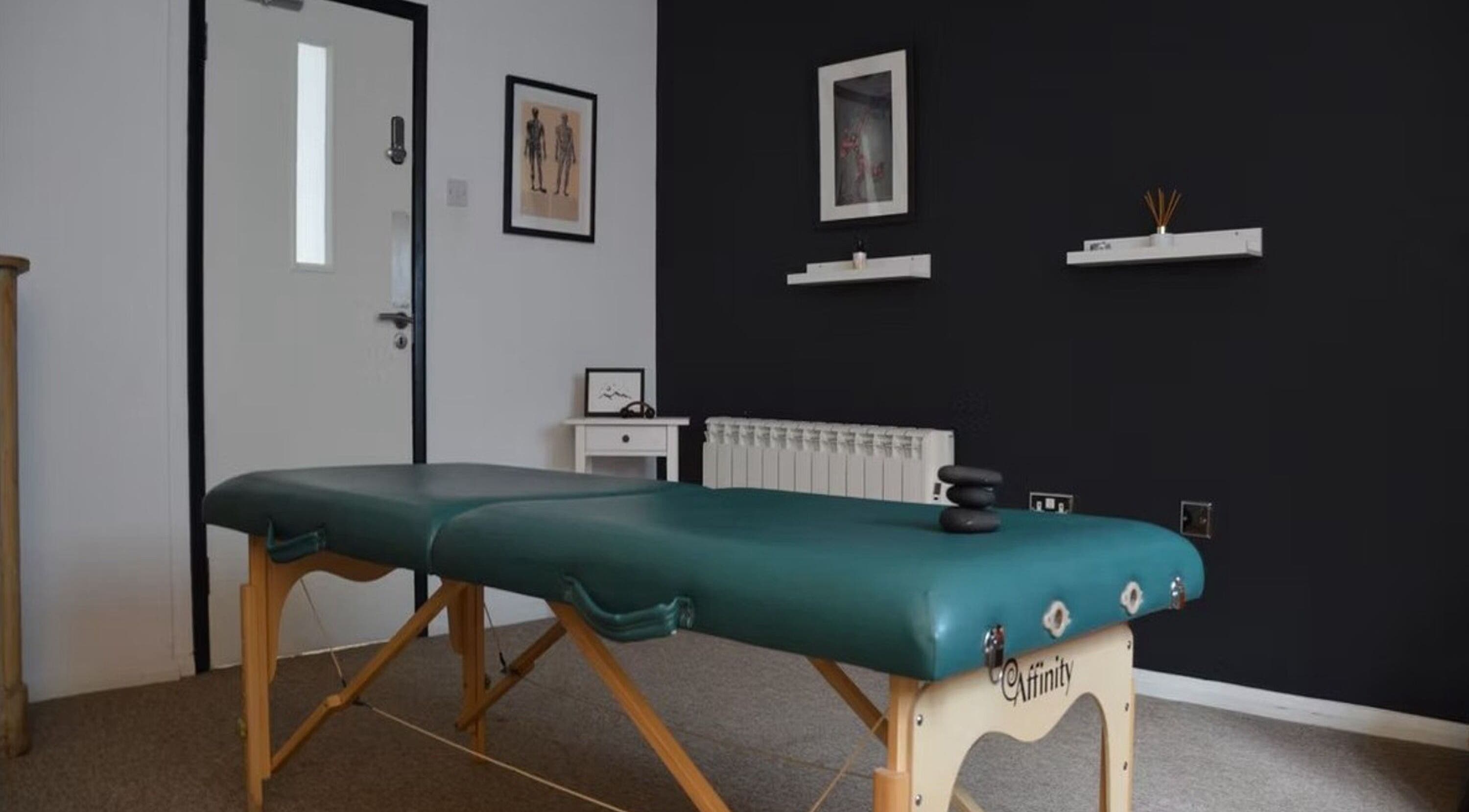 Massage table in serene room at The Unburden, Hassocks, England, GB, offering relaxing therapies.
