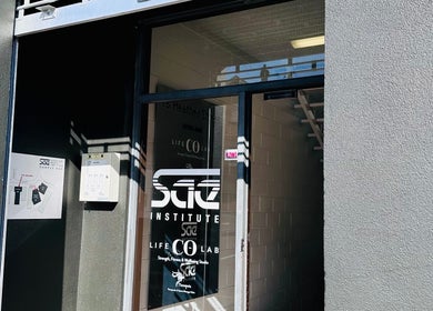 Entrance of Therapeia Limited at Auckland, Auckland, NZ with glass door and signs.