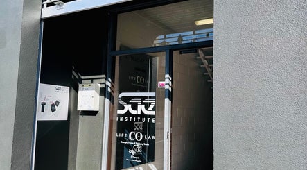 Entrance of Therapeia Limited at Auckland, Auckland, NZ with glass door and signs.