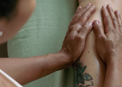 Therapist providing massage at Bruna Monteiro Yoga and Holistic Therapies, Beverly Hills, California, US.