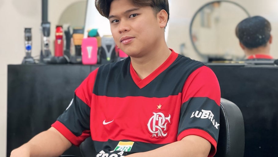Customer relaxing at NADI (NS BARBERSHOP), Kajang, Selangor, MY. Modern grooming tools are visible.