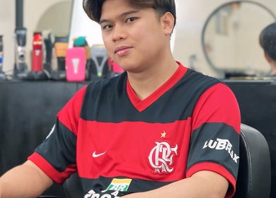 Customer relaxing at NADI (NS BARBERSHOP), Kajang, Selangor, MY. Modern grooming tools are visible.