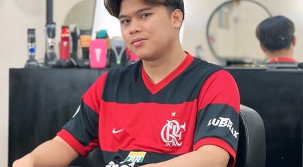 Customer relaxing at NADI (NS BARBERSHOP), Kajang, Selangor, MY. Modern grooming tools are visible.