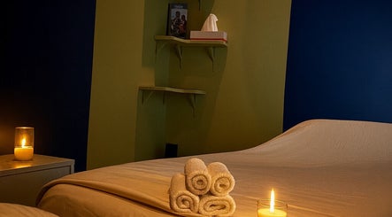 A tranquil massage room with candles at Shanti massage, Montréal, Québec, CA.