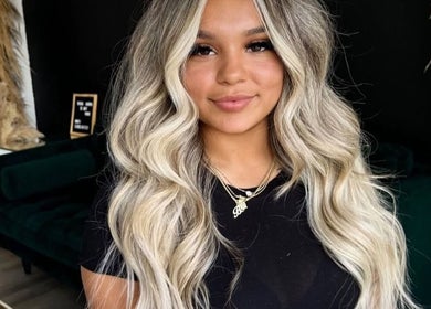 Client with styled wavy hair at Barbara SPA Queen in Dallas, Texas, US.