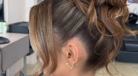 Sophisticated updo hairstyle at Barbara SPA Queen, Dallas, Texas, US. Perfect for any occasion.