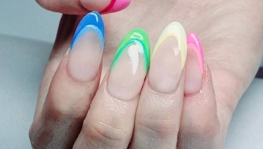 Colorful nail art at Riverside Beauty Therapy in Kempston, England, GB showcasing blue, green and pink designs.