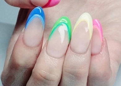 Colorful nail art at Riverside Beauty Therapy in Kempston, England, GB showcasing blue, green and pink designs.