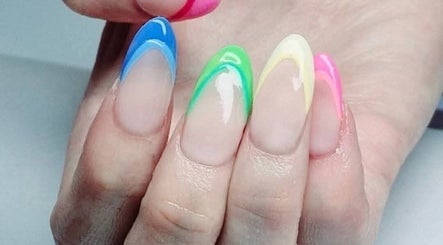 Colorful nail art at Riverside Beauty Therapy in Kempston, England, GB showcasing blue, green and pink designs.