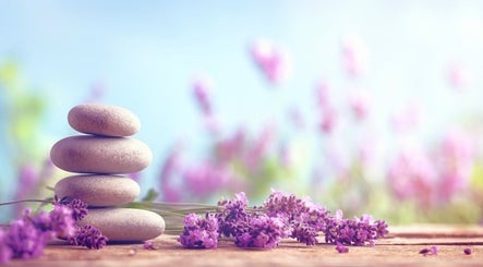Stacked stones and lavender representing Relaxation Foot Spa, Puyallup, Washington, US, evoke serenity.