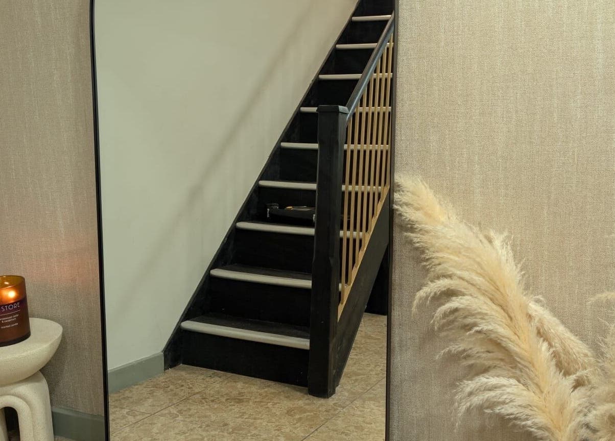 Elegant staircase view at Hair by Ava in Leeds, England, GB, with calming decor.