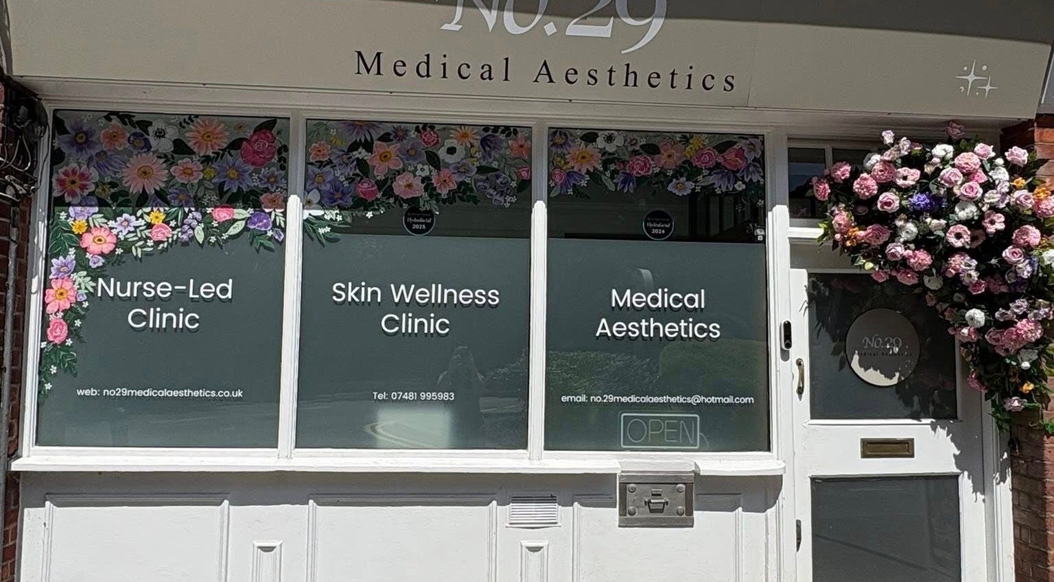 Sanctum By Gemma, Beacon Hill, England, GB showcases a floral-decorated clinic entrance for aesthetic services.