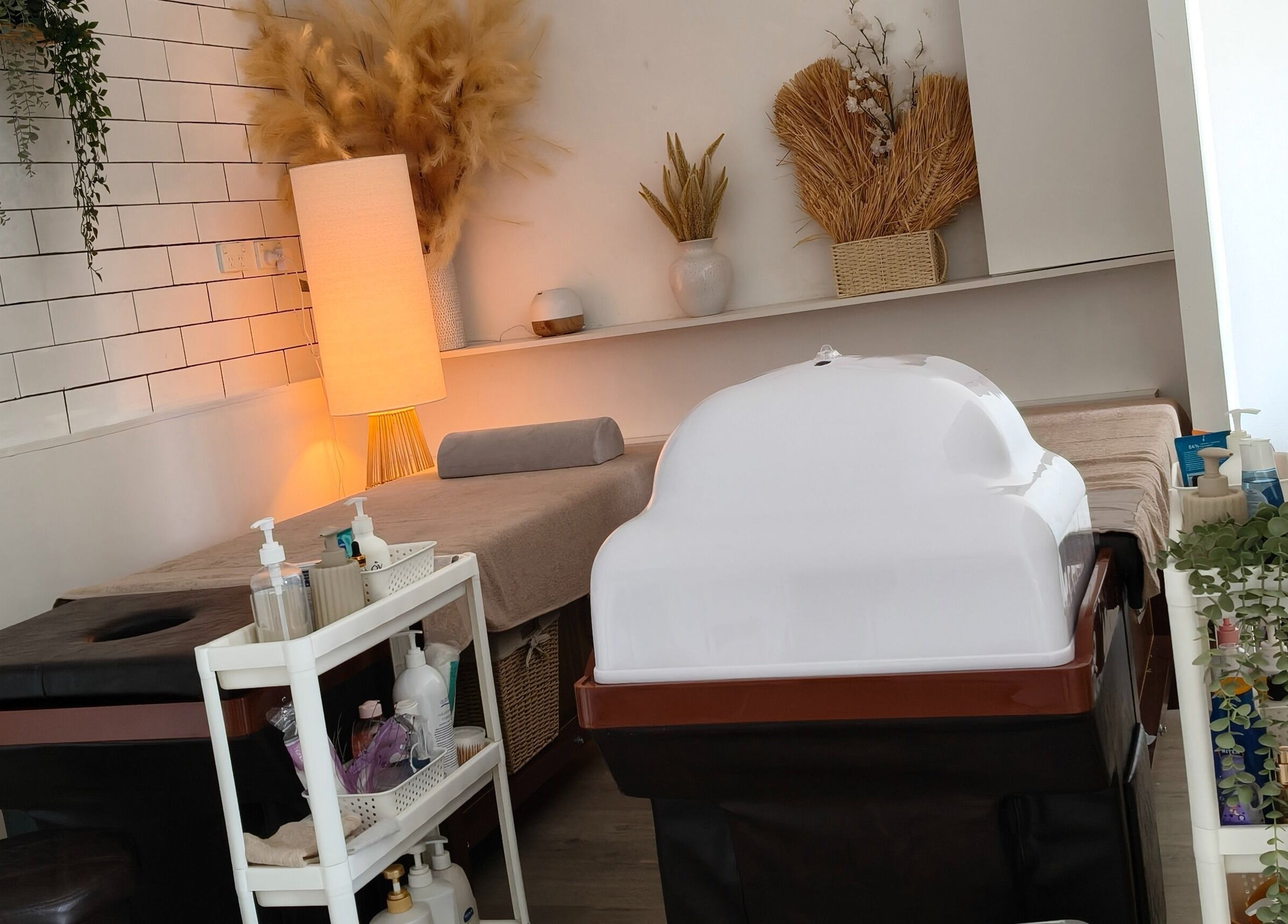 Relaxing massage room at Zenith Spa, Regents Park, New South Wales, AU with ambient lighting and soothing decor.