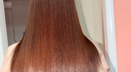 Smooth, glossy brown hair styled at Elenes Beauty, Mexicali, Baja California, MX.