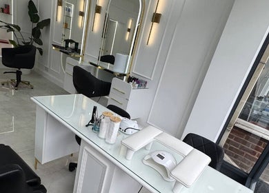 Elegant salon interior at THE MOST BEAUTY & AESTHETICS, Exeter, England, GB, featuring modern styling chairs.