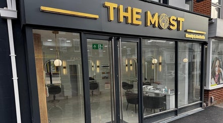 THE MOST BEAUTY & AESTHETICS front facade in Exeter, England, GB with sleek modern design.