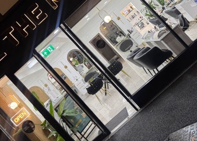 Elegant front of THE MOST BEAUTY & AESTHETICS in Exeter, England, inviting with a modern, luminous design.