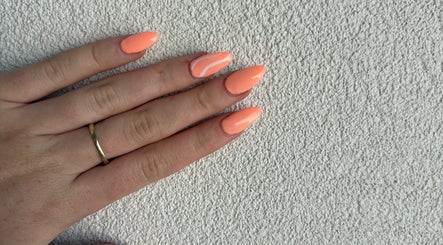 Vibrant coral manicure at Petal&Polish, Jimboomba, Queensland, AU showcasing stylish nail art.