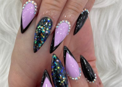Elegant glitter and pink stiletto nails at MK Nails and Spa Fulham Ltd, London, England, GB.