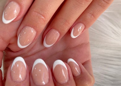 Elegant French manicure at MK Nails and Spa Fulham Ltd in London, England, GB, showcasing tidy white tips.