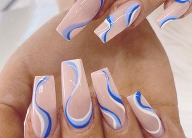 Elegant nail design with blue and white swirls at MK Nails and Spa Fulham Ltd, London, England, GB.