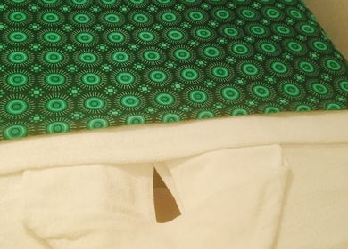 Relaxing massage table with green cover at Jojoesthaispa, Edenvale, Gauteng, ZA, offering serene wellness vibes.