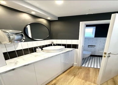 Elegant restroom in Aurelle Aesthetic Clinic, Gerrards Cross, England, GB with modern fixtures and decor.