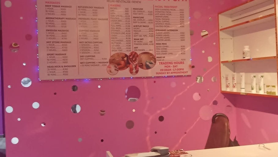 Kori's Massage and Beauty Spa vibrant pink interior showcasing services menu in Germiston, Gauteng, ZA.