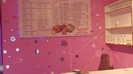 Kori's Massage and Beauty Spa vibrant pink interior showcasing services menu in Germiston, Gauteng, ZA.