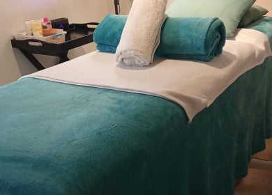Cozy massage table at Kori's Massage and Beauty Spa in Germiston, Gauteng, ZA, ready for relaxation.