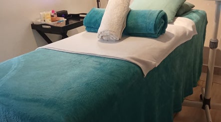 Cozy massage table at Kori's Massage and Beauty Spa in Germiston, Gauteng, ZA, ready for relaxation.