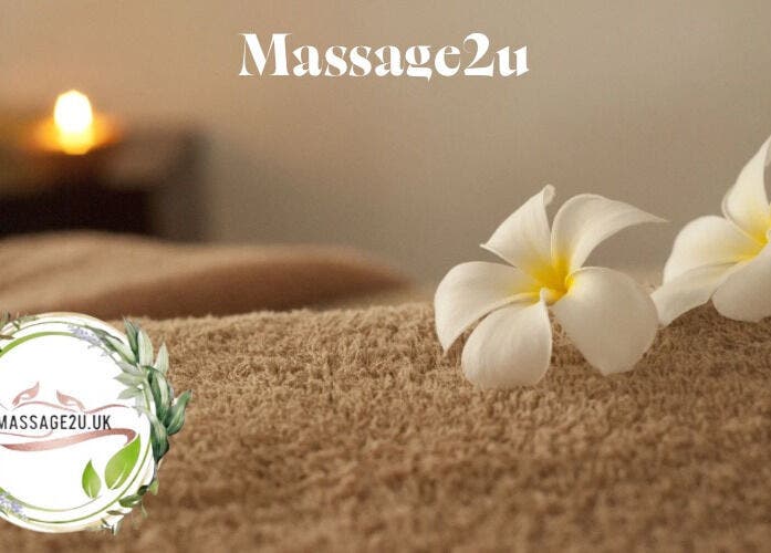 Luxurious massage setting at Massage2u.uk Ladies Only in Lawford, England with candles and flowers.