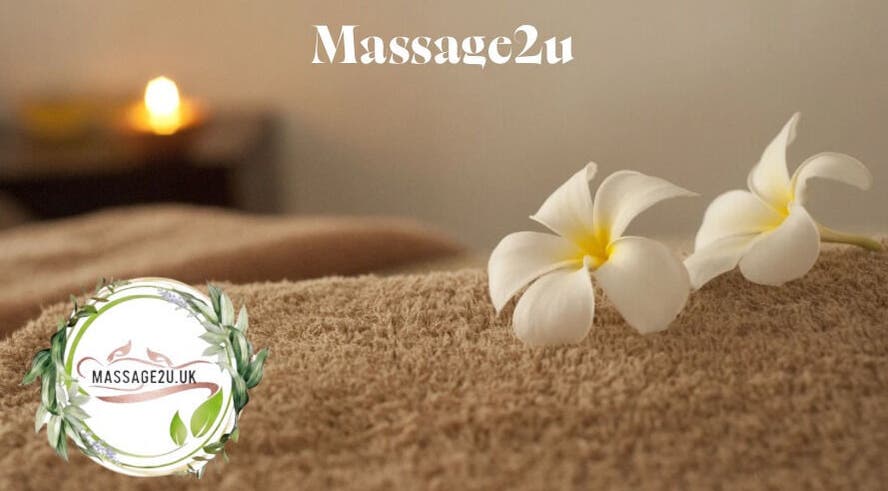 Luxurious massage setting at Massage2u.uk Ladies Only in Lawford, England with candles and flowers.