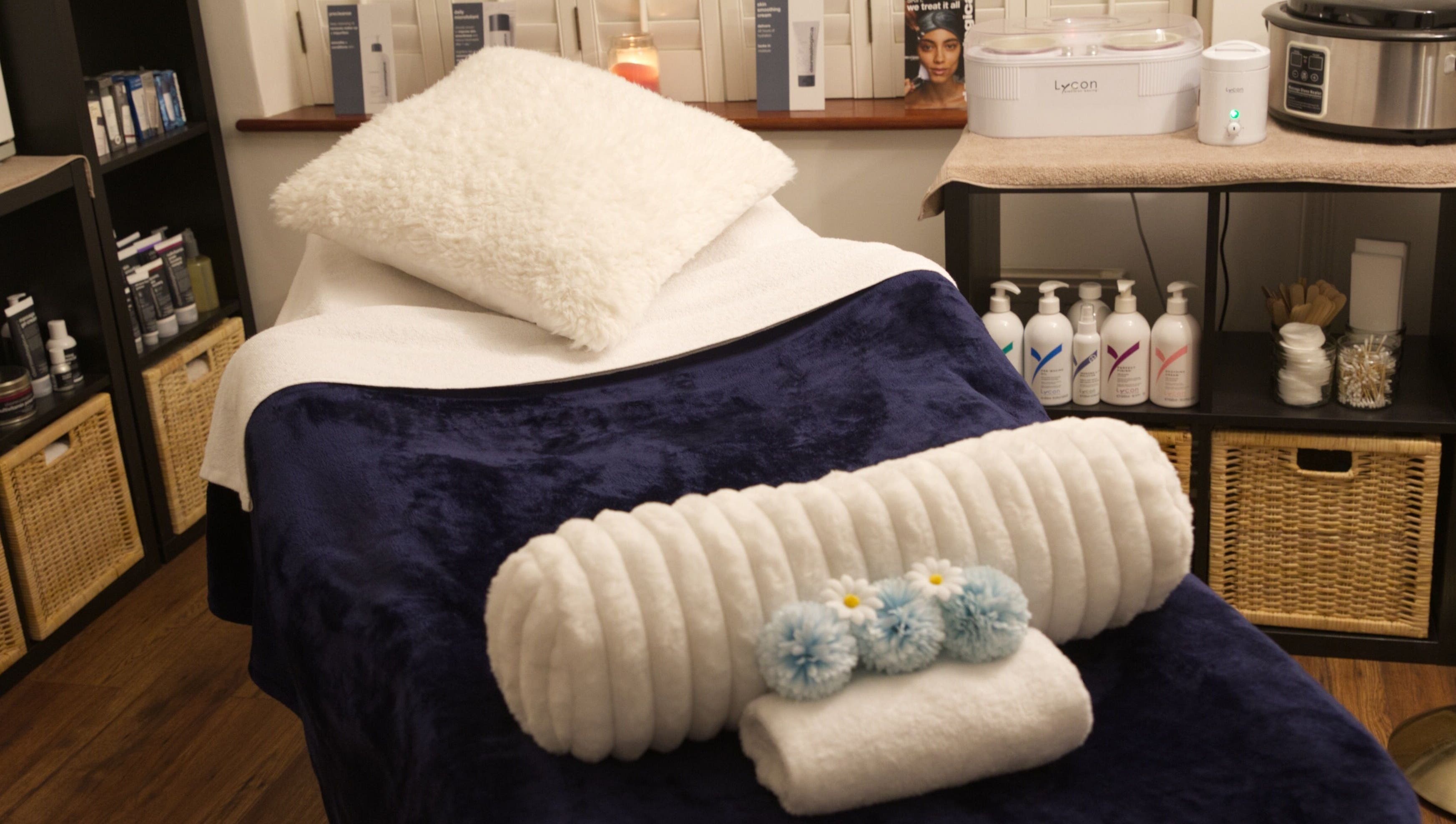 Cozy spa bed setup at TMB Beauty, Brighton, GB for a relaxing wellness experience.