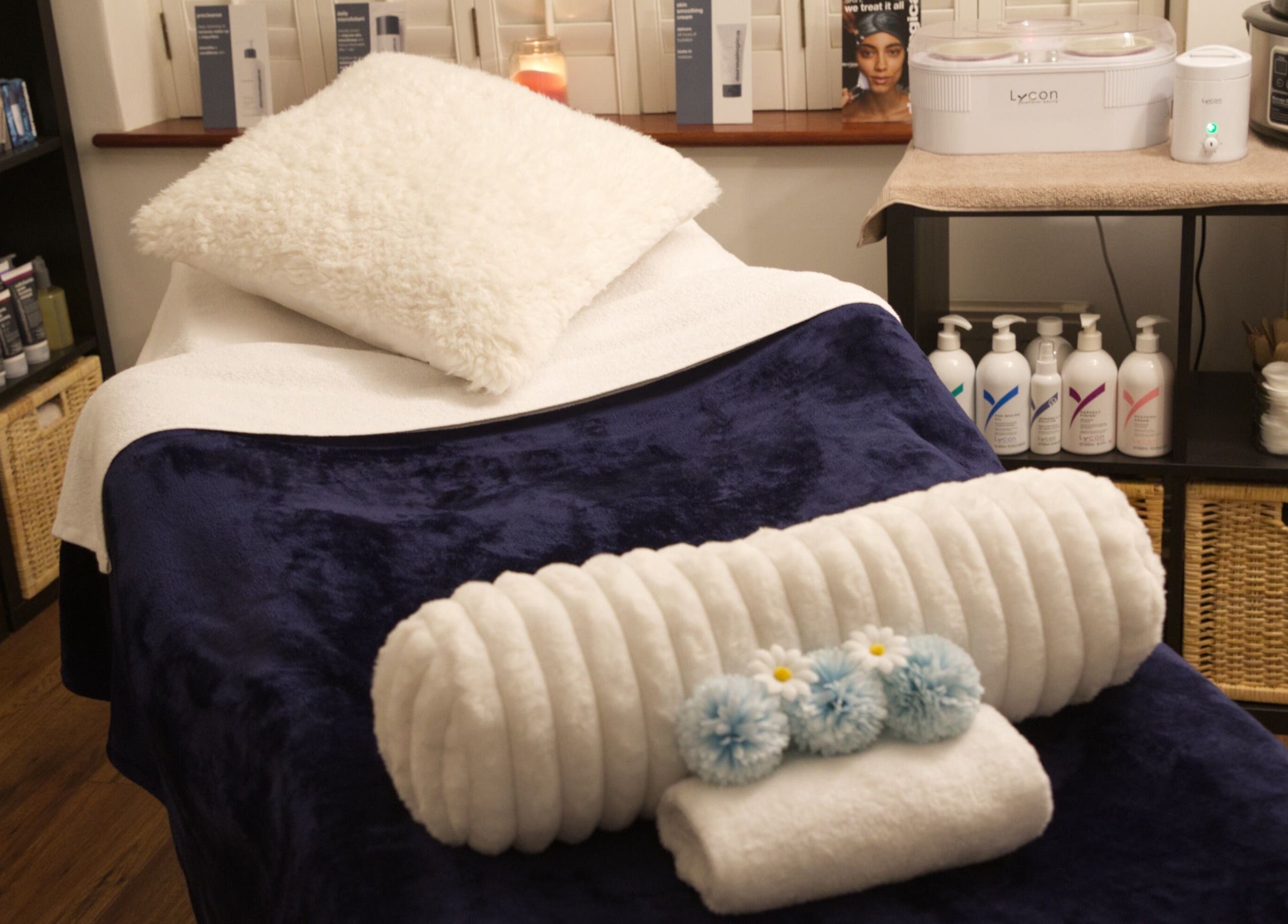 Cozy spa bed setup at TMB Beauty, Brighton, GB for a relaxing wellness experience.