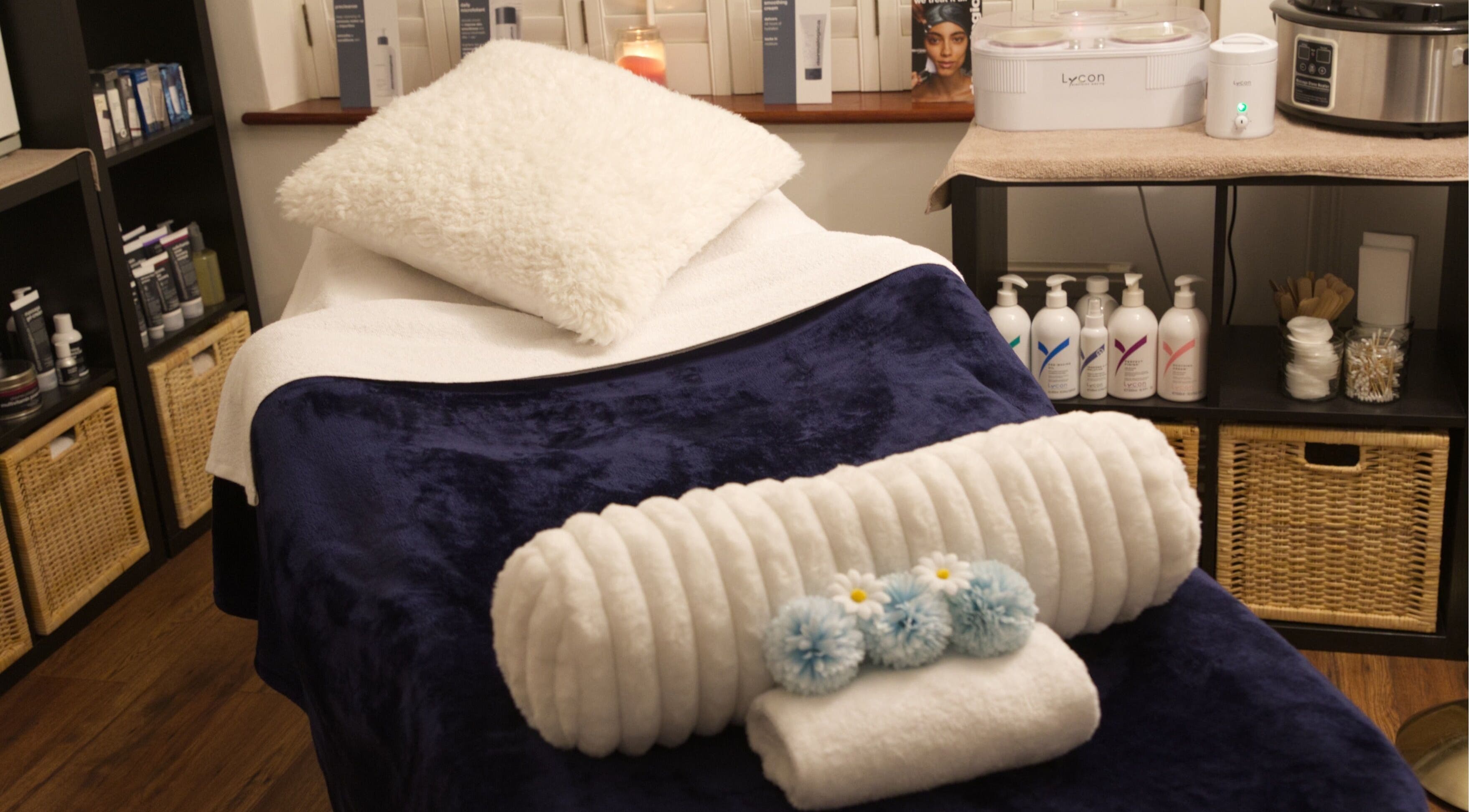 Cozy spa bed setup at TMB Beauty, Brighton, GB for a relaxing wellness experience.