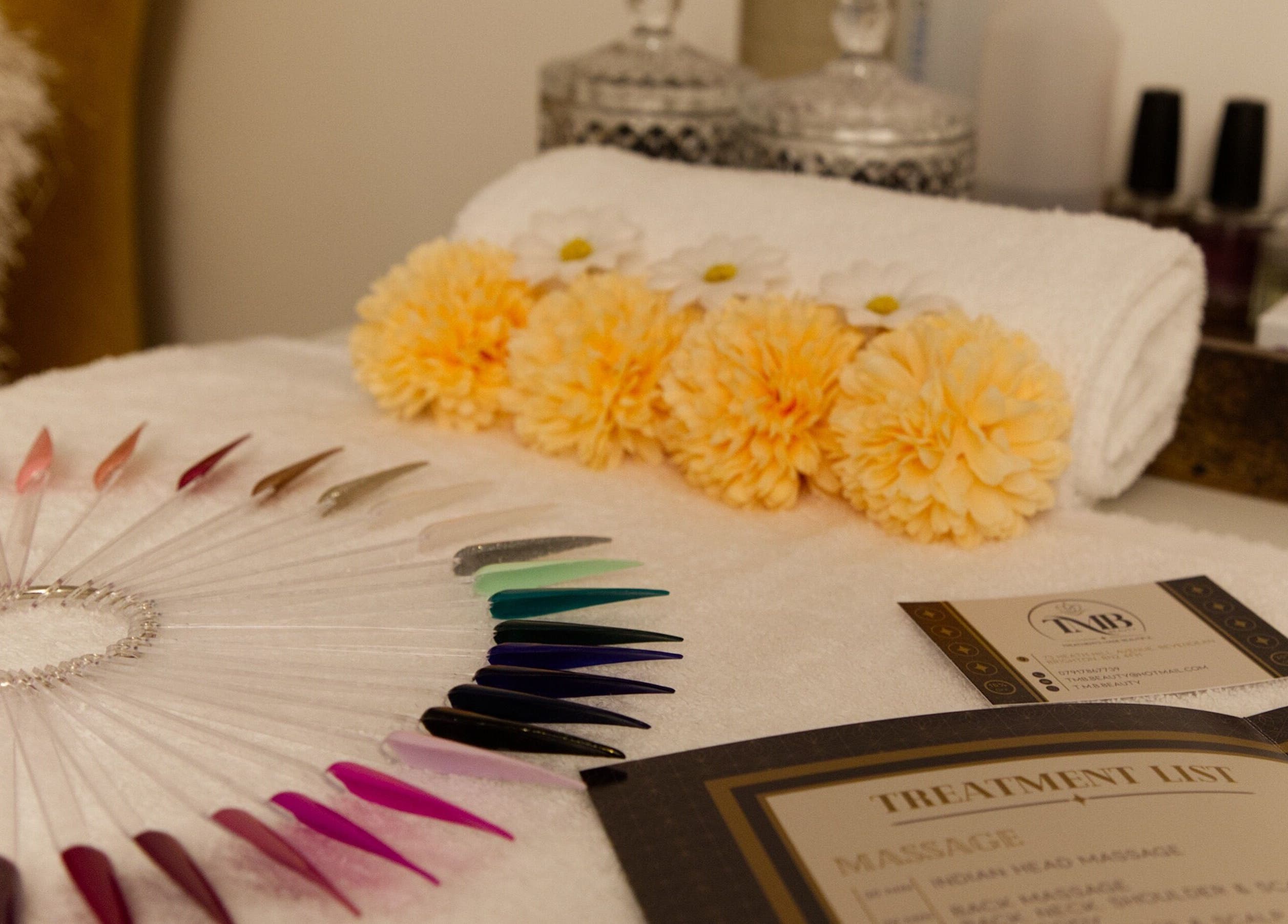 Elegant nail color display and spa setup at TMB Beauty, Brighton, GB, highlighting luxury service offerings.