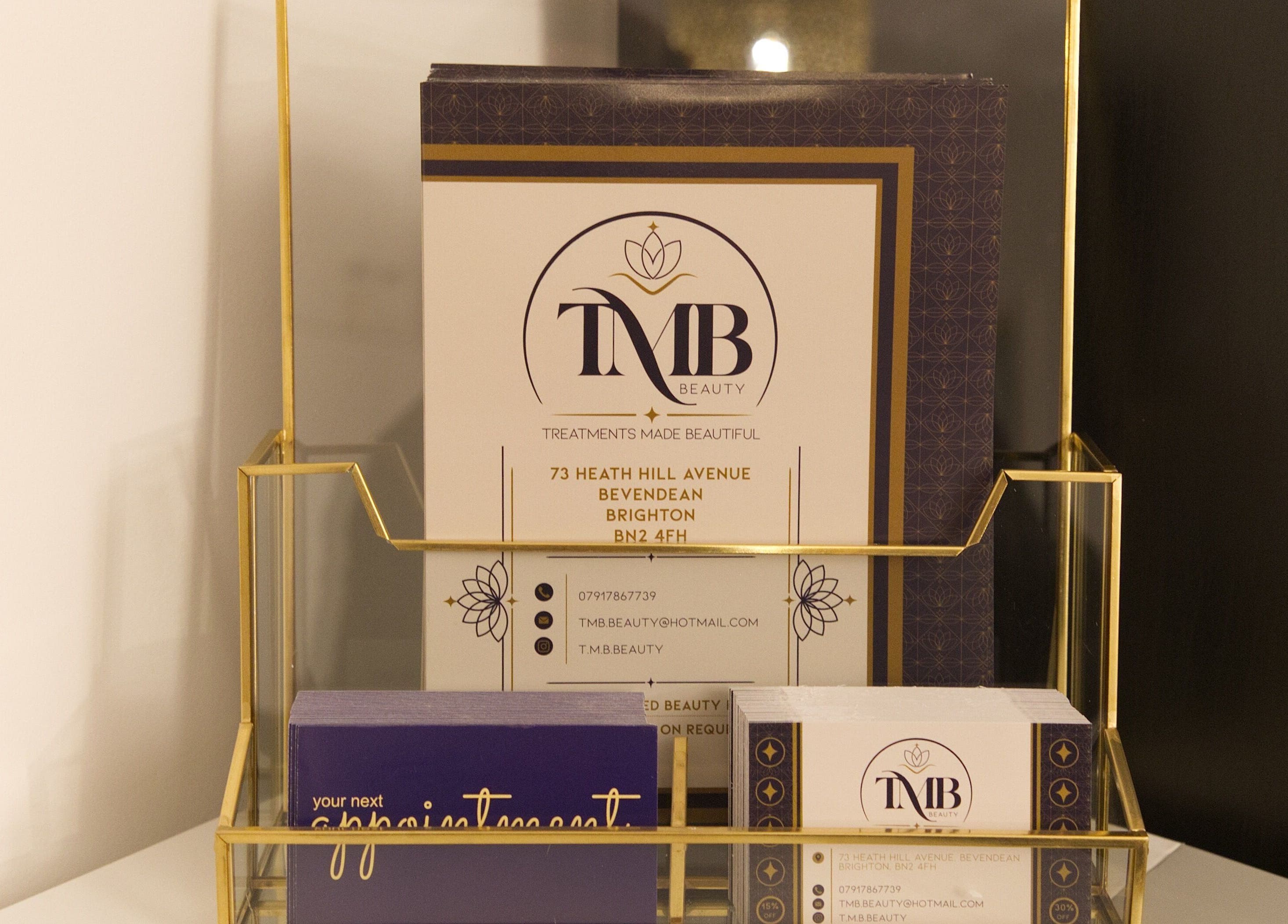 Elegant brochure holder at TMB Beauty, Brighton, GB featuring treatment details and contact information.