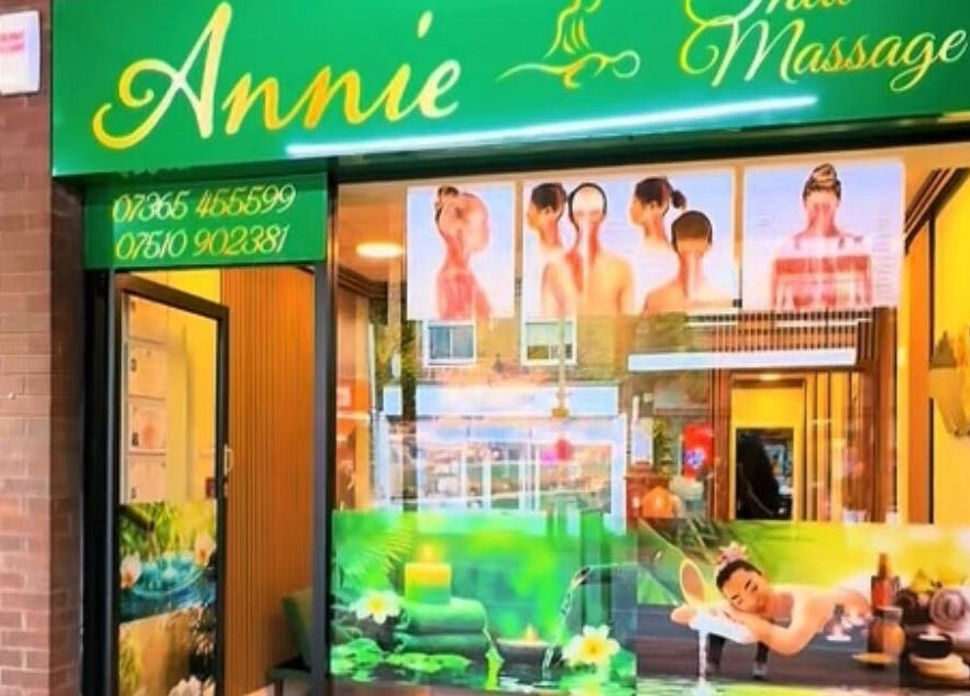 Front view of Annie Thai Massage in Egham, England, GB with calming green signage.