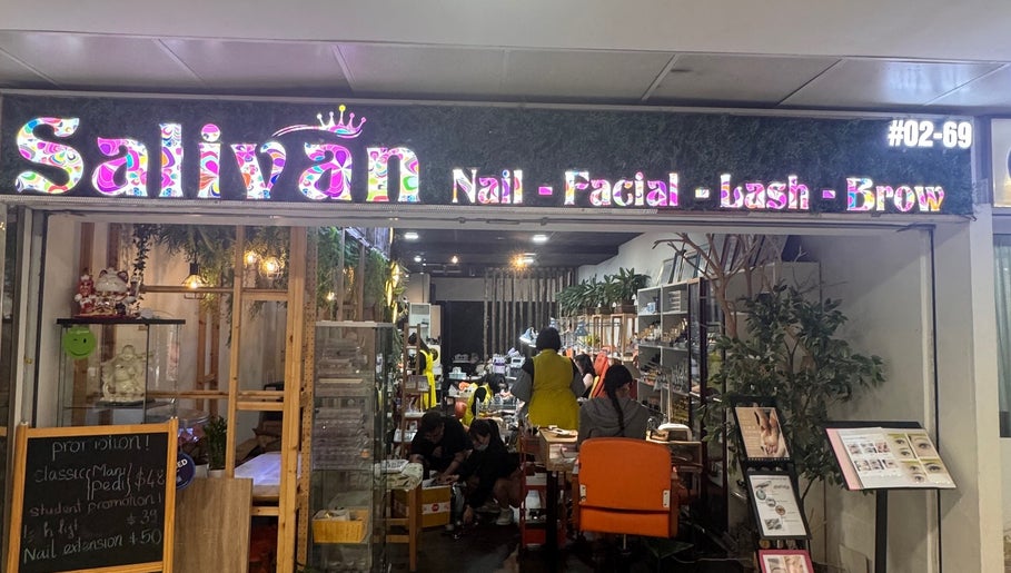 Entrance of Salivan beauty salon in Singapore, SG, showing a cozy interior with nail and facial services.