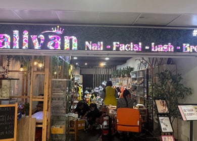 Entrance of Salivan beauty salon in Singapore, SG, showing a cozy interior with nail and facial services.