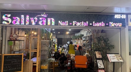 Entrance of Salivan beauty salon in Singapore, SG, showing a cozy interior with nail and facial services.