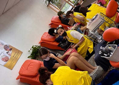 Customers enjoying pedicures at Salivan in Singapore, Singapore, SG, showcasing a cozy spa experience.