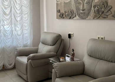 Relaxing chairs and serene decor in Orchid Spa, Rīga, LV, offering peaceful wellness experiences.