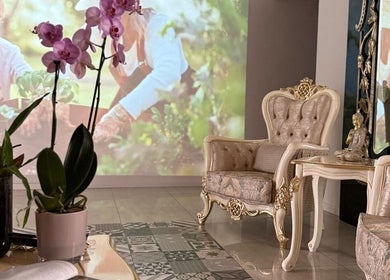 Luxurious seating area with orchids at Orchid Spa, Rīga, LV promotes relaxation and serenity.