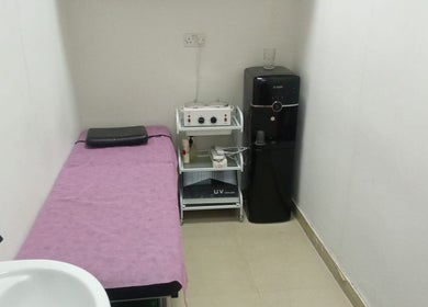 Treatment room at Sabeen Adnan Beauty Salon in Sharjah, Sharjah, AE, featuring bed and equipment.